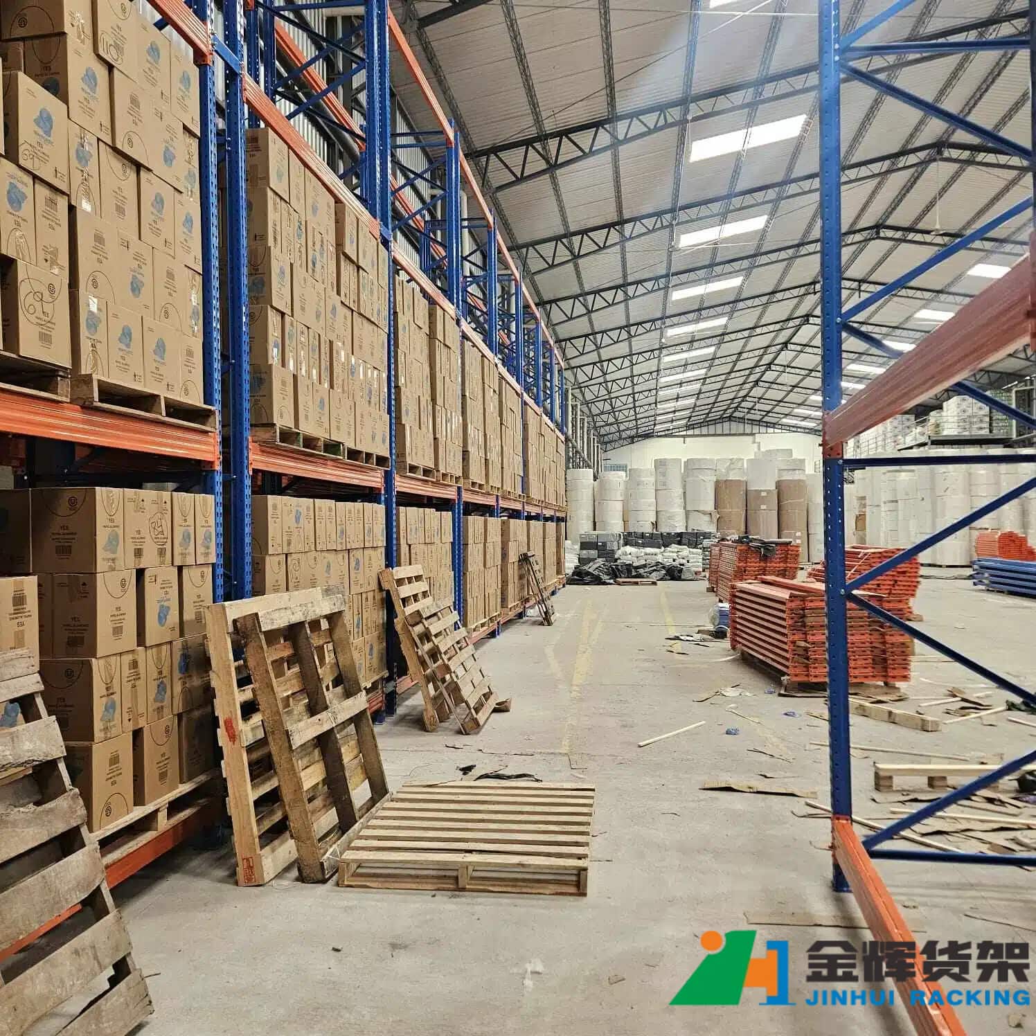 warehouse workers installing pallet racking system with proper alignment and safety equipment warehouse workers installing pallet racking system with proper alignment and safety equipment